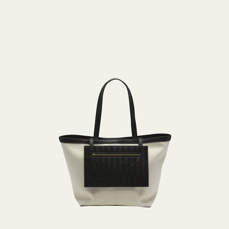 Bottega Veneta tote bag in leather and cotton  Flat shoulder straps  Exterior, front zip pouch can be reversed to be placed inside  Approx. 13.8"H x 9.6"W x 9.1"D Made in Italy Coated Canvas Top Handle Shoulder Bag For Shopping, Luxury Canvas Satchel With Removable Pouch, Designer Canvas Bag With Detachable Handle For Everyday, Elegant Canvas Shoulder Bag With Top Carry Handle, Elegant Canvas Shoulder Bag With Top Handle, Elegant Canvas Satchel Bag With Removable Pouch, Elegant Canvas Bag With Removable Pouch And Double Handle, Elegant Satchel Canvas Bag With Removable Pouch, Designer Tote Shoulder Bag For On-the-go