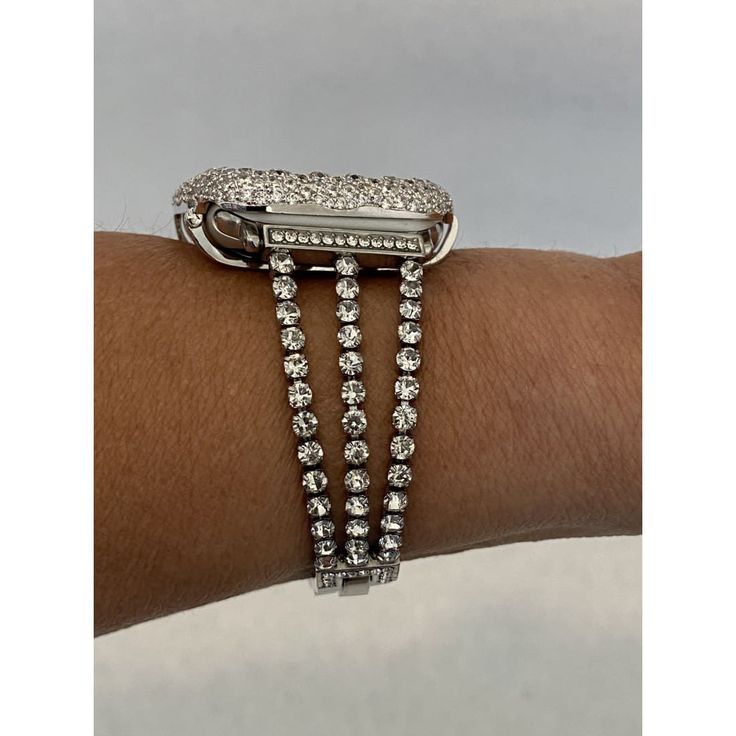 Bling Apple Watch Band. Fits the Apple Watch available for sizes 38,40,41,42,44 and 45mm in series 1,2,3,4,5,6,7 or SE Men's & Women's. Silver Apple Watch Band Womens Style Iwatch Band High Quality Crystal Rhinestone Prong Set Tree Strands on each side of this Zinc Plated Watch band. Adjustable chain closure- Five links can be removed making sizing easy. Simply remove a folding clasp to make appropriate fit to your wrist, no tools needed! Suitable for 5.1-7.8 inch wrists. Jeweled Watch Band. Add Silver Apple Watch Band, Silver Apple Watch, Apple Watch Band Women, Apple Watch Cover, Series 7 Apple Watch, Candy Watch, Apple Aesthetic, Silver Apple, Apple Watch Bands Women