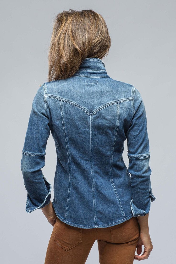 We all know that you cherish your favorite jeans like an old friend. Well, now it's time to have a party and invite someone new. For years we have searched for the perfect denim shirt- one that felt authentic, but not 'boardy', comfortable but not flimsy. Finally, we decided to have one made for us in Italy. After countless trials of hand-dying and washing, we are ready to introduce our new friend: The Sweetwater Denim Shirt. One of those friends you feel like you've known and loved for years wi Ladies Denim Shirt Outfit, Denim Shirts For Women, Denim Shirt Women, Western Denim Shirt With Button Closure, Western Dark Wash Denim Shirt, Vintage Dark Wash Denim Shirt, Luxury Dark Wash Denim Shirt, Faded Denim Button-up Tops, Embroidered Denim Shirt