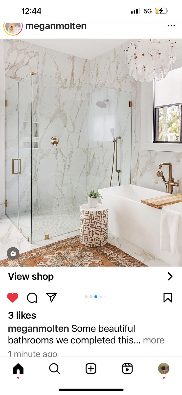 a bathroom with marble walls and flooring in the shower area is featured on instagram