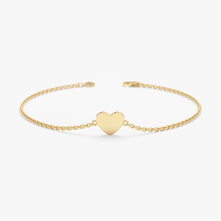 Embrace timeless elegance with the Minimalistic Design Solid Gold Heart Bracelet. This exquisite bracelet features a delicate 14k solid gold chain (available in yellow, white, or rose gold) adorned with a simple and polished heart-shaped charm. - Solid Gold - Handmade - The Dimension of the Heart: 5.5 x 7.5 mm 🛠 Your Sarah Elise piece is handcrafted with care! Ready-to-ship items go out within 3 business days. Made-to-order pieces typically take 7-10 business days to create. If you need something sooner, please contact us - we'll see if we can make it happen! For estimated shipping dates and tracking, check your Etsy account under 'Orders'. 🚐Orders under $100 are sent with USPS First Class Mail tracking; orders more than $100 are sent with FedEx 2nd Day. To ensure your package's safe arr Elegant Adjustable Heart Bracelet For Formal Occasions, Elegant Gold Heart Bracelet With Adjustable Chain, Elegant White Gold Heart Pendant Bracelet, Elegant White Gold Heart-shaped Chain Bracelet, Elegant White Gold Heart Bracelet For Valentine's Day, Elegant Heart-shaped Bracelet For Formal Occasions, Elegant Heart Shaped Bracelet For Formal Occasions, Elegant Formal Bracelets For Valentine's Day, Elegant Formal Heart-shaped Bracelet