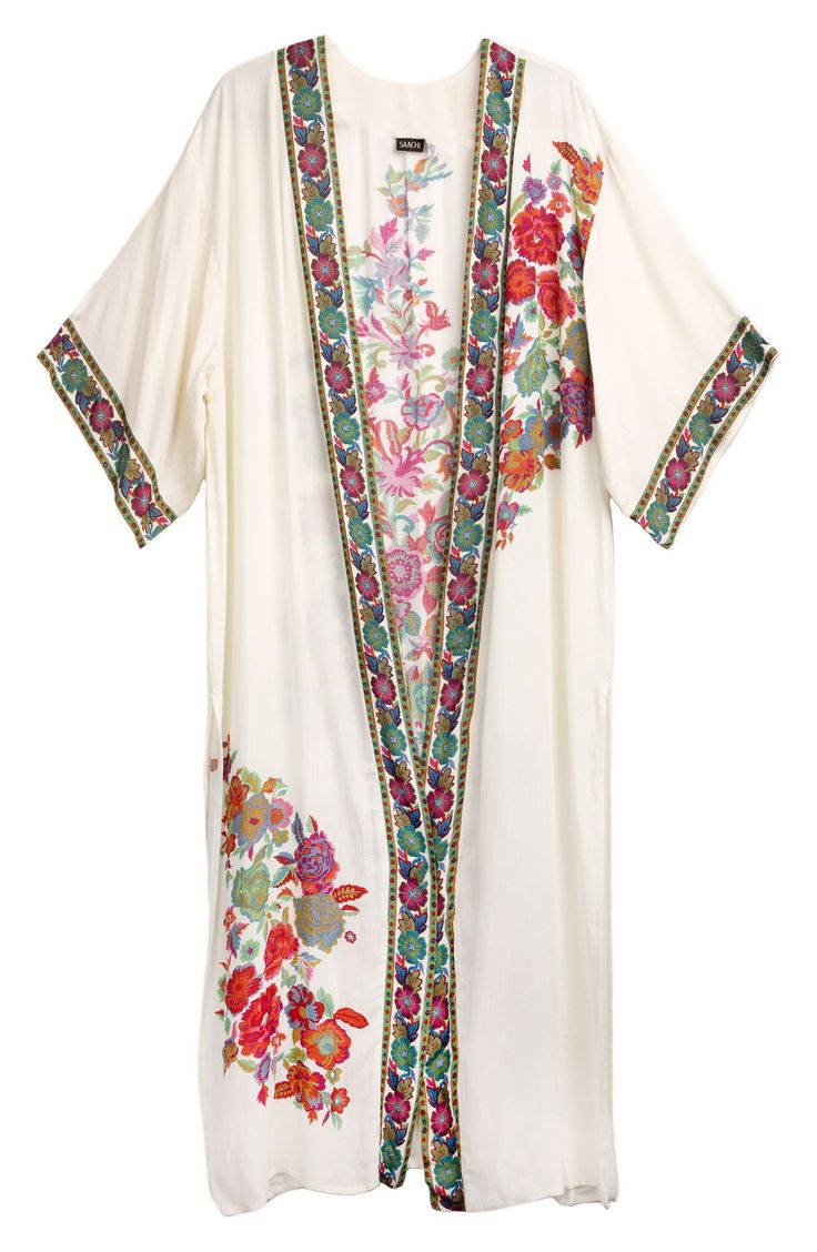 A vibrant floral print adorns a maxi length kimono that brings romantic boho style to any look. 54" length Open front Bracelet length kimono sleeves Floral border and back prints Lightweight woven construction Side vents 100% rayon Hand wash cold, line dry Imported Model’s stats for sizing: 5’10” height, 34” bust, 27” waist, 35” hips. Model is wearing size OS. Long Bohemian Kimono With Multicolor Embroidery, Festive Bohemian Kimono With Floral Embroidery, Bohemian Long Kimono With Intricate Embroidery, Romantic Boho Style, Long Multicolor Floral Embroidered Kimono, Summer Floral Embroidered Multicolor Kimono, Romantic Boho, Kimono Sleeves, Penny Lane