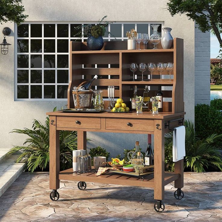 an outdoor bar cart with drinks on it