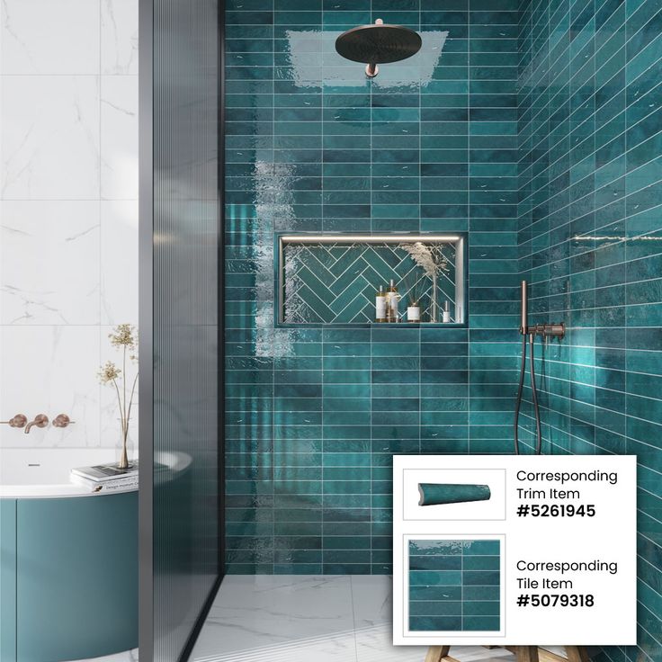 a bathroom with blue tiles on the walls and floor, along with a shower head