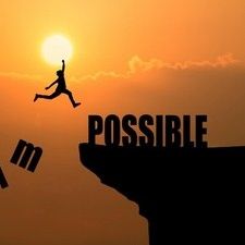 the silhouette of a person jumping off a building into the sky with the word possible above them