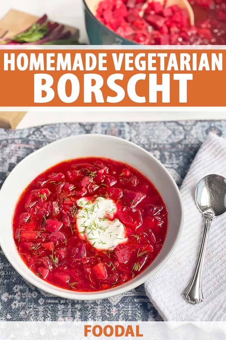 a bowl of homemade vegetarian borsch with sour cream on top and spoons next to it