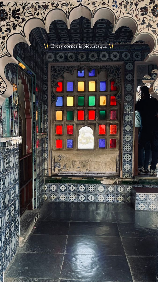 the inside of a building with many colorful glass blocks on it's doors and windows