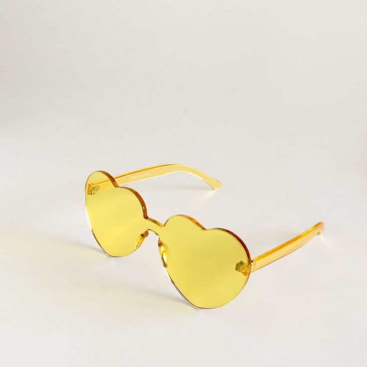 Color your world and spread a little love! It's hard to have a bad day when you're wearing these sunnies. Perfect for concerts in the park and happy hours on the patio with your homies. YELLOW = cheerfulness + clarity of mind + creativityYellow brings thoughts of sunshine and warmth. It's traditionally related to the solar plexus chakra - the seat of our connections with others, creativity and personal freedom. Connect with others and create positive change in your world! Made from polycarbonate Trendy Tinted Sunglasses As Gift, Trendy Sunglasses For Spring Gift, Playful Tinted Lens Sunglasses For Festival, Adjustable Heart Shaped Sunglasses For Summer, Fun Festival Sunglasses With Tinted Lenses, Fun Summer Sunglasses For Music Festivals, Fun Sunglasses For Summer Music Festivals, Yellow Rimless Sunglasses For Summer, Heart-shaped Sunglasses With Tinted Lenses As Gift