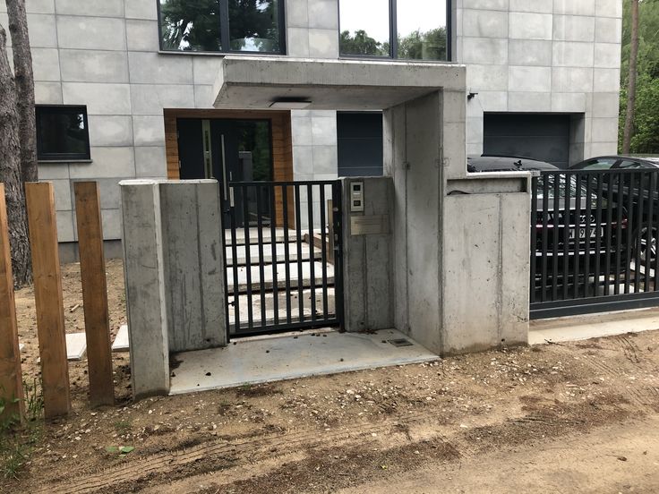 a gated entrance to a building that is under construction