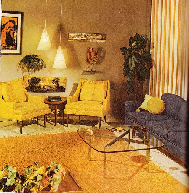 a living room filled with yellow and blue furniture