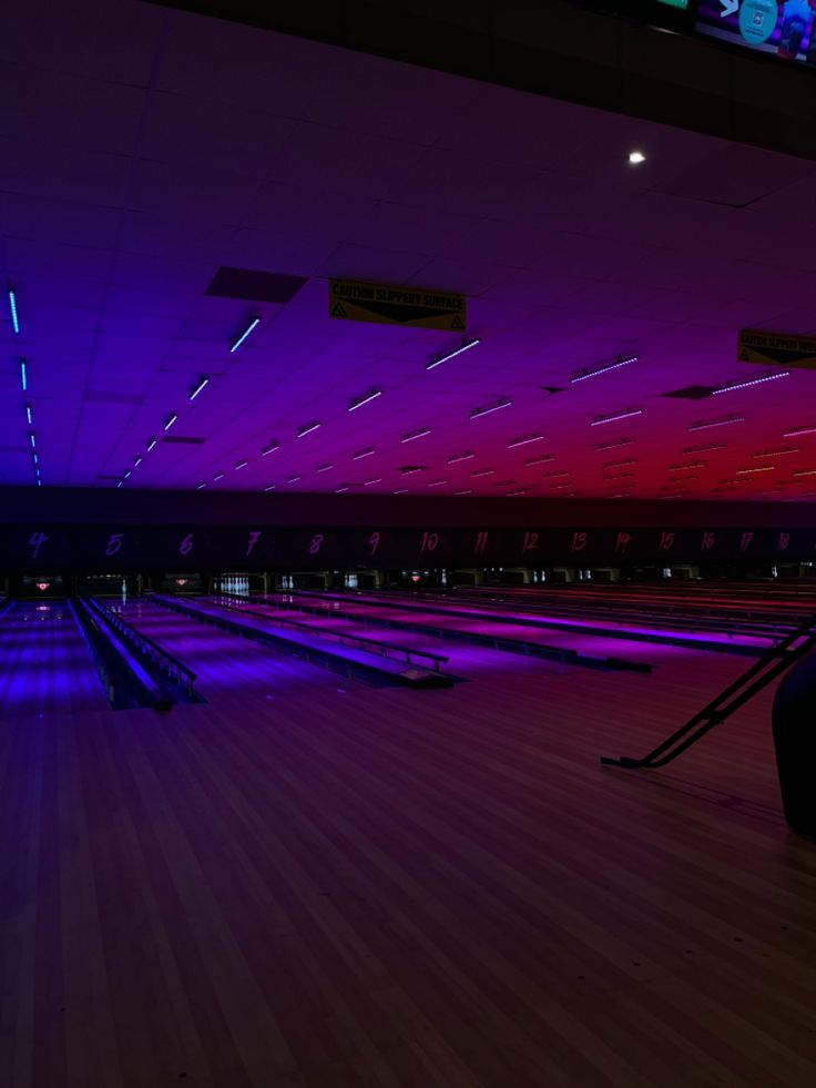 Purple and pink lights over a bowling alley Bowling Alley Background, Swaggy Wallpapers, Bowling Alley Aesthetic, Jovial Playground, Alley Ideas, Neon Led Lights, Cosmic Bowling, Gaming Lounge, Chicago Aesthetic