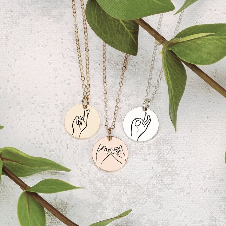 Treat your loved ones to something totally unique, totally creative, and totally YOU - the Hand Gestures Necklace. The perfect gift to let your friends and family know how much they truly mean to you! The coolest gift ever! Perfect for sharing your love with friends, sisters, and besties, our signature disc necklace features unique, hand-drawn expressions of sign language, designed by Melanie. Show your special someone just how much you care with a one-of-a-kind sign like 'I love you', 'peace', Drawn Expressions, Hand Gestures, 20 Inch Necklace, Hand Gesture, Princess Necklace, Month Gifts, Heart Face Shape, Wear Necklaces, Round Necklace