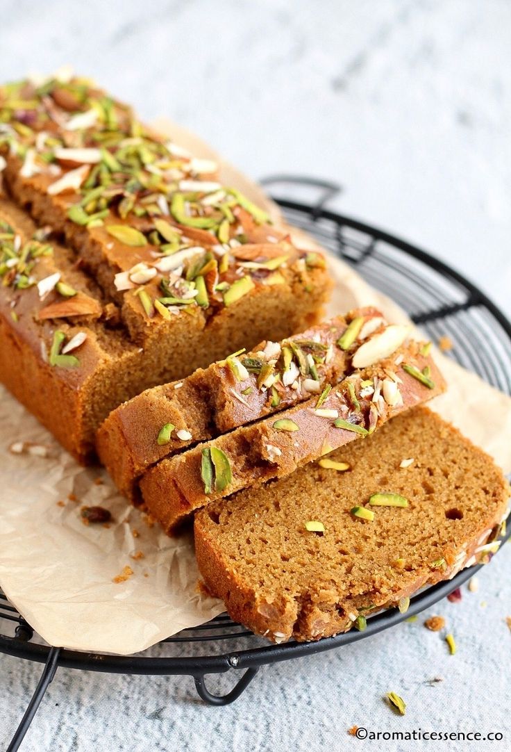 sliced loaf of pumpkin spice bread on a wire rack