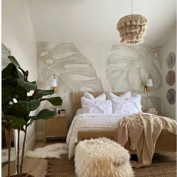 a bedroom with a bed, rugs and plants on the wall next to it