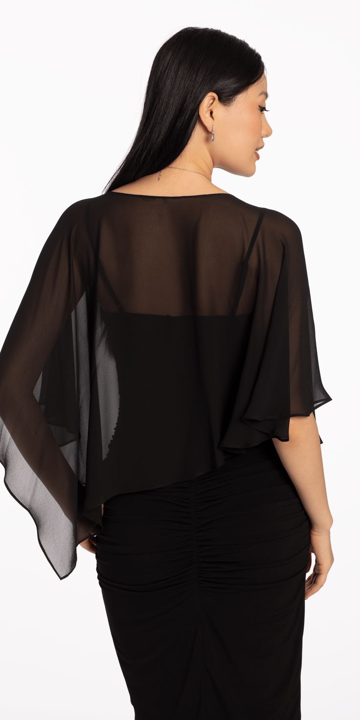 Introducing our Asymmetrical Chiffon Capelet, an accessory that adds a touch of elegance to any outfit. Made with delicate chiffon fabric, this capelet drapes gracefully over the shoulders, creating a sophisticated and exclusive look. Perfect for formal events. Pair it with Cubic Zirconia Drop Earrings and a dressy handbag to complete the look. Chic Party Tops With Overlay, Chic Party Top With Overlay, Black Chiffon Formal Tops, Elegant Chiffon Top For Night Out, Elegant Chiffon Blouse For Night Out, Flowy Chiffon Evening Tops, Evening Sheer Chiffon Top, Flowy Chiffon Top For Evening, Elegant Party Blouse With Overlay