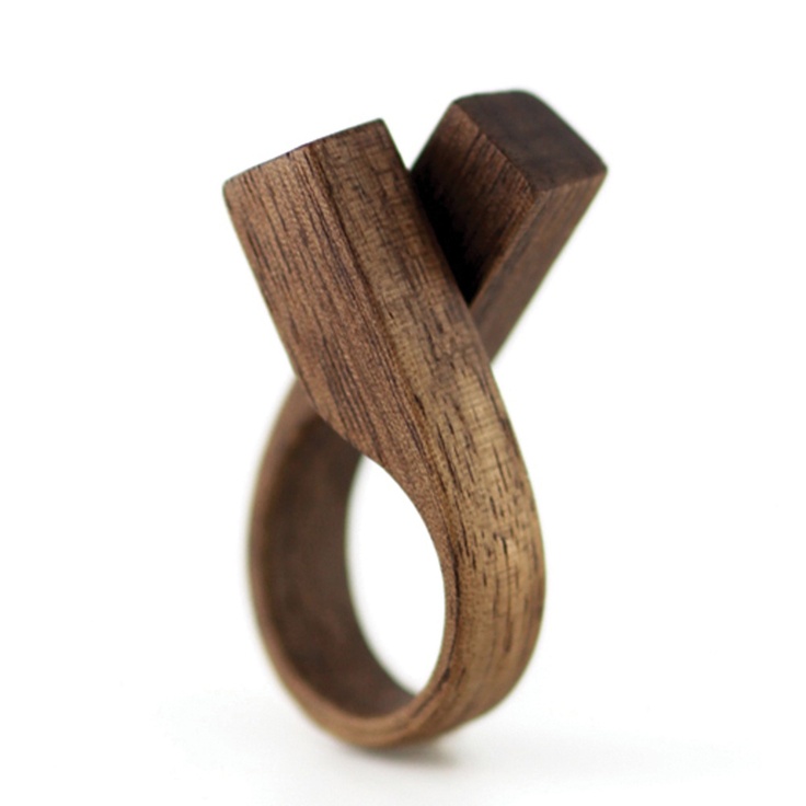 a wooden ring with an unusual design on it