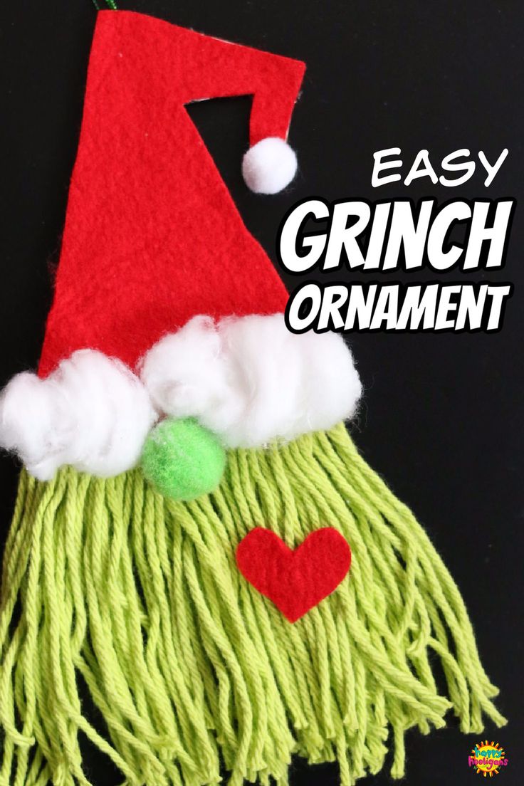 an easy christmas ornament made out of yarn with santa's hat on top