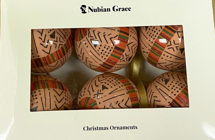 a box with six ornaments inside of it