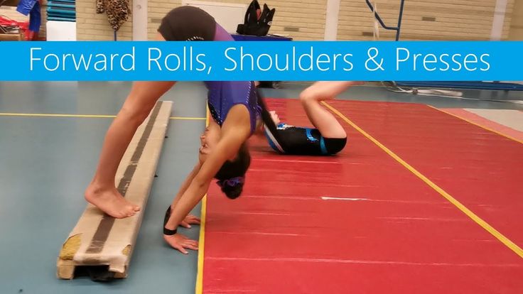 two people doing exercises on a mat in a gym with the words forward rolls, shoulders & presses