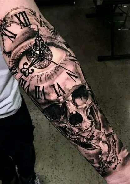 a man with a clock and skull tattoo on his arm