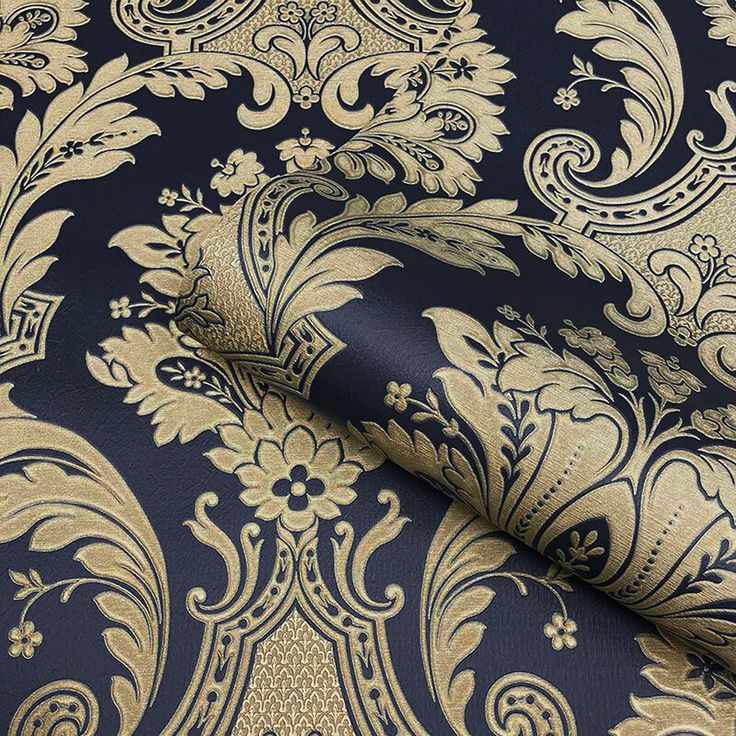 a blue and gold wallpaper with an intricate design on it's surface,