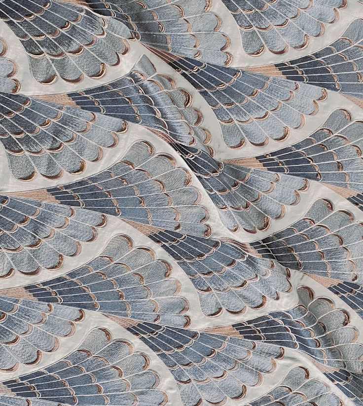 an image of a blue and white fabric with large, intricate designs on it's sides