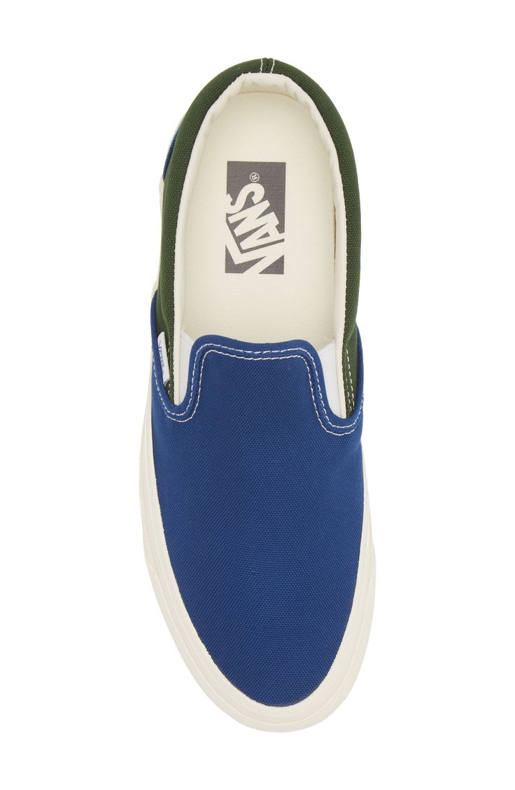 With a colorblock canvas upper and chunky bumper sole, this reissue of an iconic skate sneaker is a must-have for your casual rotation. Slip-on style with elastic gore insets Removable insole Textile upper and lining/rubber sole Imported Blue Canvas Sneakers For Streetwear, Vans Canvas Sneakers For Streetwear, Blue Canvas Shoes With Vulcanized Sole For Skateboarding, Canvas Slip-on Sneakers With Rubber Sole For Streetwear, Blue Canvas Skate Shoes With Rubber Sole, Canvas Slip-on Sneakers For Streetwear, Sporty Canvas Shoes With Logo Patch And White Sole, Sporty Canvas Shoes With Logo Patch, Slip-on Canvas Sneakers For Streetwear