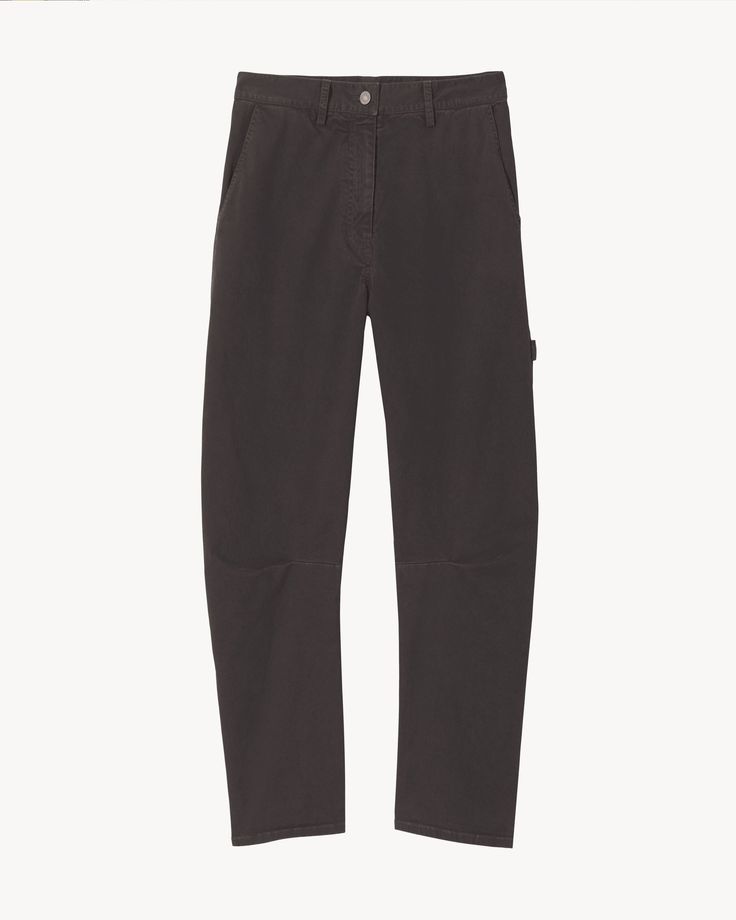 The Carpenter Pant is an oversized, wide-leg cotton trouser. It features a button closure with zip fly, two slash pockets at the front, classic utilitarian pocket details and a hammer loop on the side. Nili Lotan, Carpenter Pants, Back Patch, Military Green, Pocket Detail, Jet Black, Blue Sea, Dark Navy, Army Green