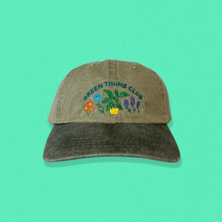 Perfect for the garden enthusiast and green thumb! This dad hat has a pre-worn feel and look and is perfect for your trips to the greenhouse or when tending to the garden. Embroidered directly onto a super comfy dad hat, that's sure to become your new favorite. Hat specs: 100% cotton pigment dyed twill Unstructured, six-panel, low profile Self-fabric sweatband and six sewn eyelets Self-fabric strap with brass snap buckle and sewn grommet Green Curved Brim Dad Hat For Outdoor, Spring Green Trucker Hat With Curved Bill, Green Curved Bill Trucker Hat For Spring, Green Curved Visor Hat For Outdoor, Green Dad Hat For Outdoor Spring Activities, Spring Outdoor Dad Hat With Curved Brim, Green Trucker Hat For Spring Outdoor, Green Baseball Cap For Spring Outdoor Activities, Spring Green Trucker Hat For Outdoor