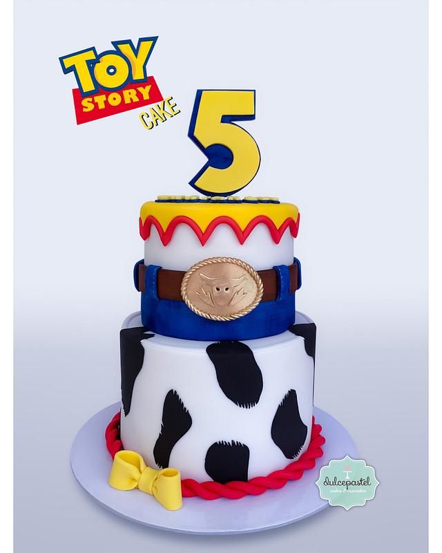 a toy story birthday cake with the number 5 on it's top and an image of a cow