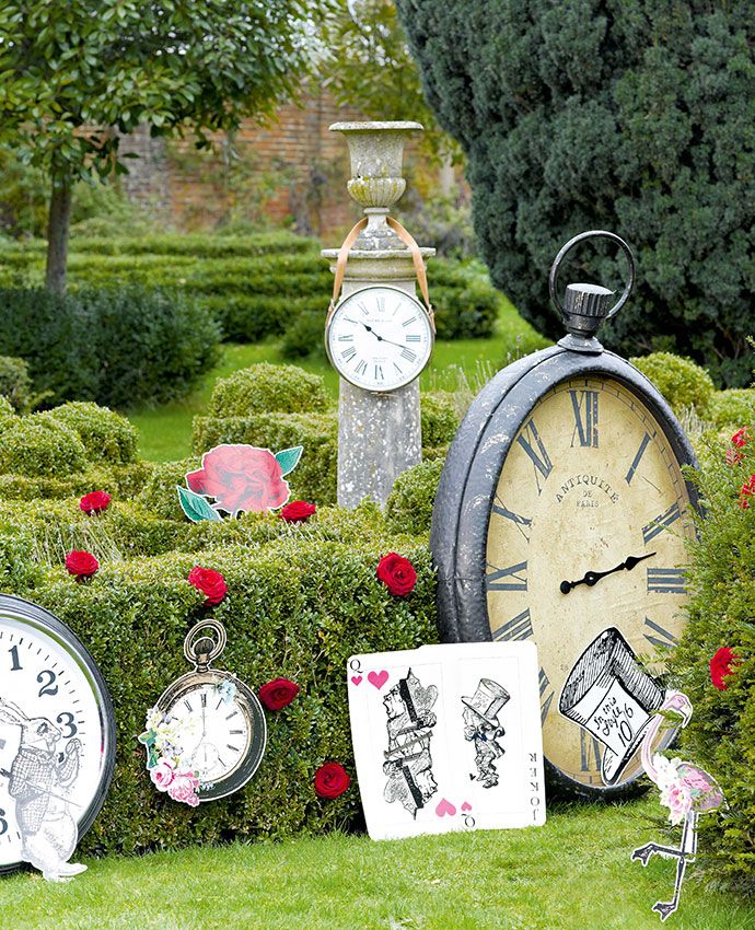 there are many clocks in the garden on display