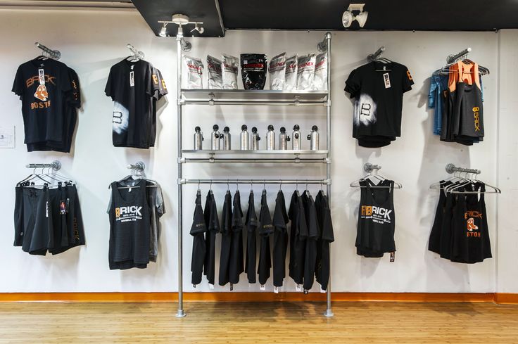 a store display with t - shirts hanging on the wall