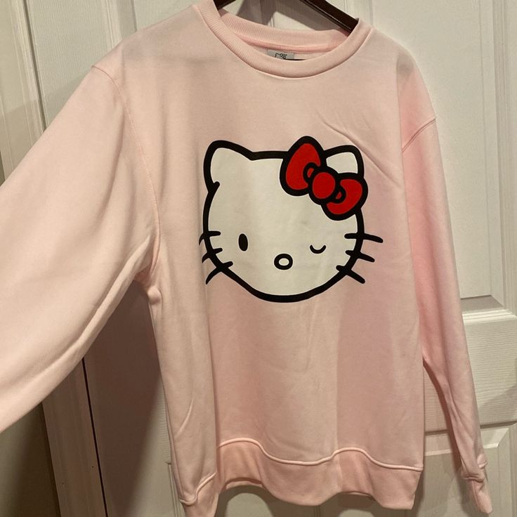 Bnwt Hello Kitty Sweatshirt With ‘Hello Kitty’ Embellishment On One Arm Fast Next Day Shipping From A Smoke And Pet Free Home Cute Cotton Sweatshirt With Hello Kitty Print, Winter Cotton Tops With Hello Kitty Print, Casual Crew Neck Sweatshirt With Cat Print, Cute Hello Kitty Print Crew Neck Sweatshirt, Hello Kitty Print Crew Neck Cotton Sweatshirt, Hello Kitty Print Crew Neck Top For Winter, Trendy Hello Kitty Print Crew Neck Sweatshirt, Winter Hello Kitty Print Crew Neck Top, Kawaii Long Sleeve Top With Cat Design