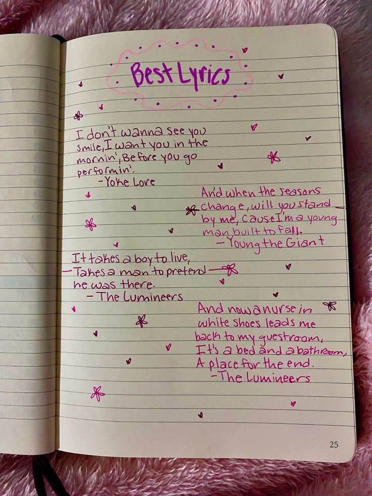 an open notebook with writing on it and the words'best lyros'written in pink ink