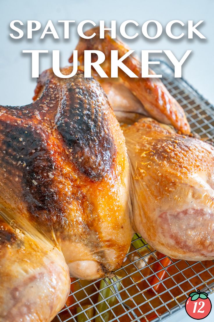 a close up of a chicken on a rack with the words spatchock turkey