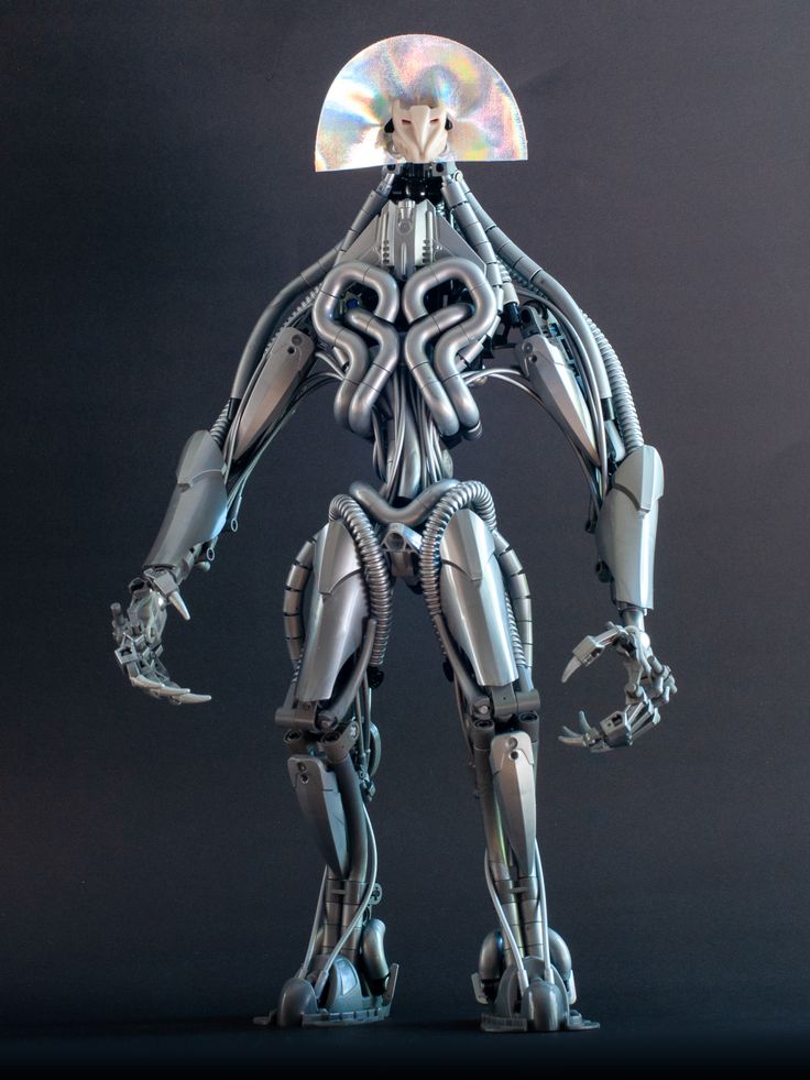 the robot is standing with his arms spread out and hands on his hips as if he were holding a disc