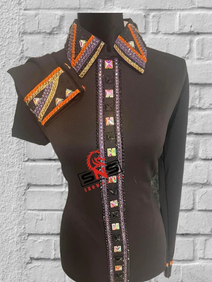 a mannequin wearing a black shirt with multicolored patches on the collar