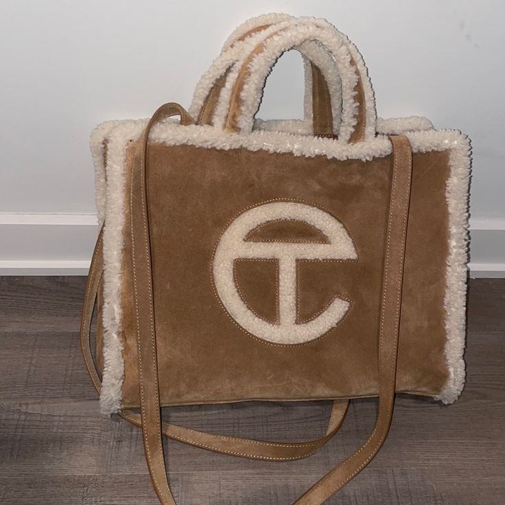 ***Last Listing Was Not Sold**** Hey Y’all, I Ordered This Bag During Christmas Last Year And I Don’t Use It At All (3 Times). It’s Authentic, I Just Don’t Like The Brand As Much. Ask Any Questions You Need, I’m Just Selling Because I Don’t Use It. I Paid The Original Price $290, So I Just Want Money Back. Listing Price Is Based On Poshmark’s Charges And In Order For Me To Get Full Refund. Telfar Ugg, Telfar X Ugg, Telfar Shopping Bag, Telfar Bags, Ugg Bag, Telfar Bag, Western Outfits Men, Luxury Bags Collection, Chestnut Color