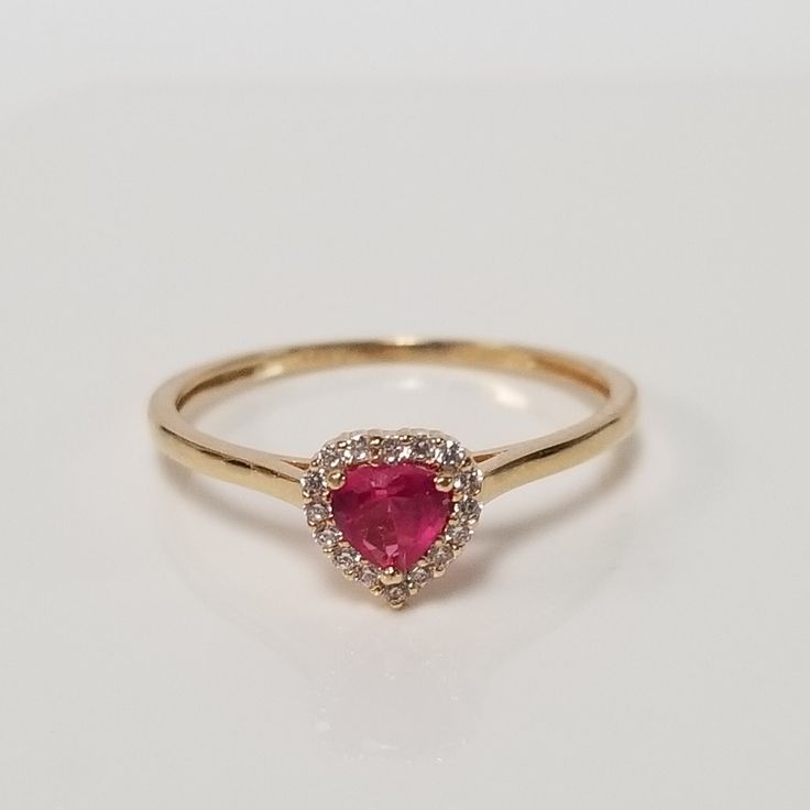 "Thanks for shopping our vintage estate store. We tend to sell well below wholesale and truly hope you enjoy all of our items. Many of the items are one of a kind, so please enjoy scrolling through the pictures and hopefully something will catch your eye. Blacks spots are from reflections. Beautiful estate 14k yellow white gold created ruby .25ct heart with .10ct cz diamond ring. Ring size: 7 Setting: 1/4\" 6.5mm Band width: 1.5mm Weight: 1.12 grams There are 16 cz diamonds. Beautiful ring, mark Valentine's Day 14k Stamped Fine Jewelry Diamond Ring, Valentine's Day Birthstone Ring With Diamond Accents, Classic Valentine's Day Birthstone Ring, Valentine's Day Classic Round Birthstone Ring, Heirloom Heart Ring With Birthstone For Valentine's Day, Classic 14k Gold Diamond Ring For Valentine's Day, Classic Birthstone Ring For Valentine's Day With Prong Setting, 14k Stamped Diamond Ring For Valentine's Day, 14k Heart Cut Ring For Valentine's Day