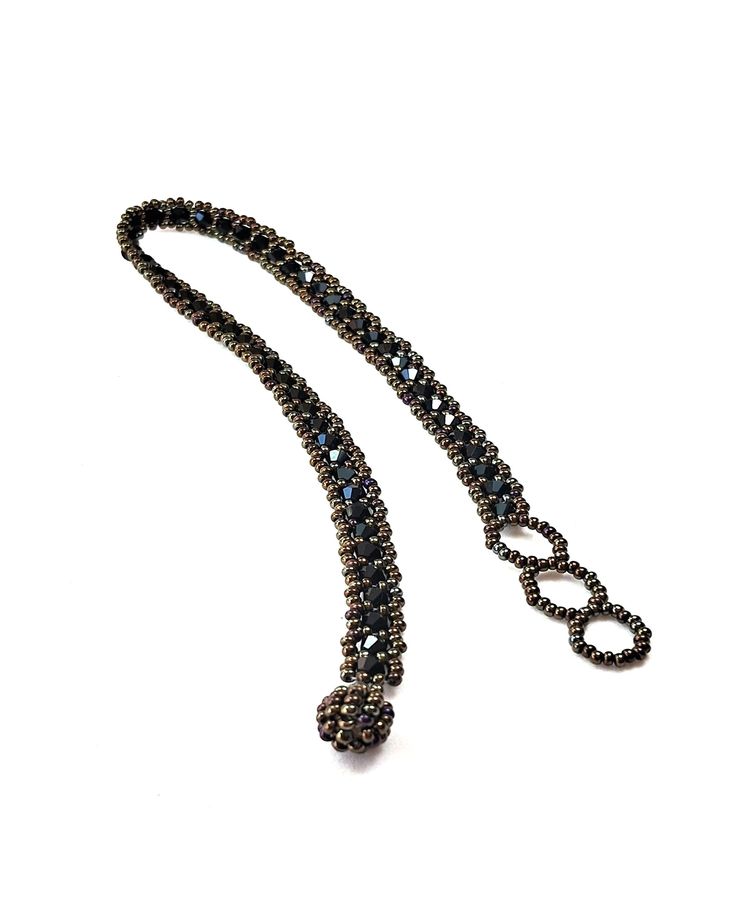 Tulua® Handmade Beaded Crystal Choker, Necklace - Black Add a touch of natural elegance to your accessory collection with our Handmade Beaded Crystal Choker in vibrant Black from Tulua®. Meticulously crafted with love, this choker is perfect for any occasion--whether you're lounging on the beach, navigating your daily routine, attending a special event, or celebrating a wedding. Tulua® chokers are handmade with 100% natural crystals, ensuring each piece is unique and full of character. Designed Black Beads Necklace Designs, Choker Black, Beaded Necklace Designs, Black Choker Necklace, Black Bead Necklace, Black Choker, Crystal Choker, Black Necklace, Necklace Black