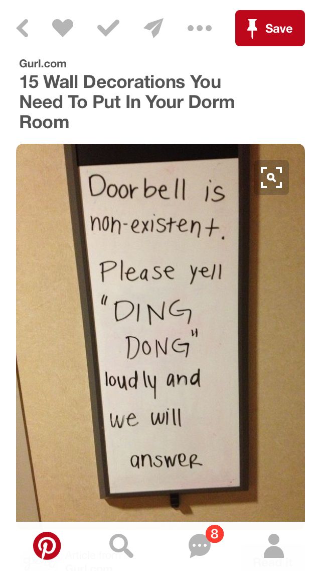 a sign that is on the wall in front of a door with words written below it