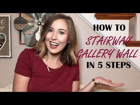 a woman standing in front of stairs with the words how to starhawk gallery wall in 5 steps