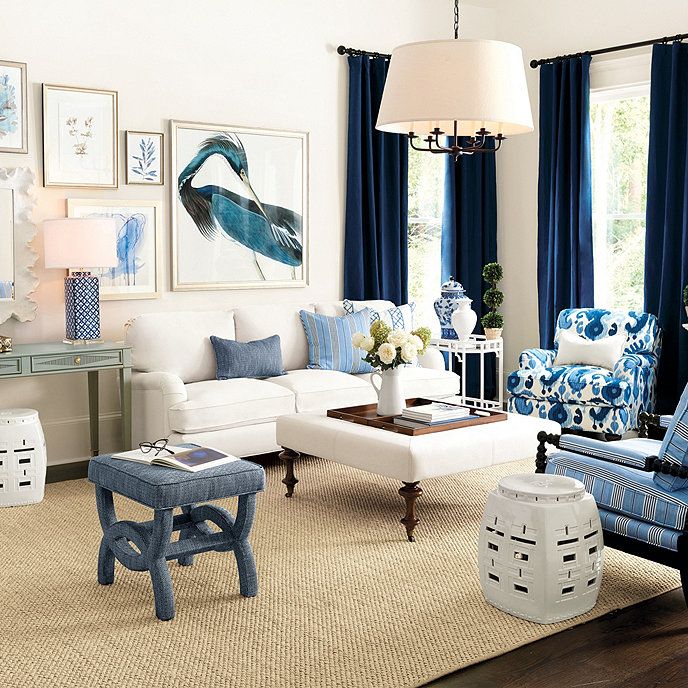 a living room with blue and white furniture