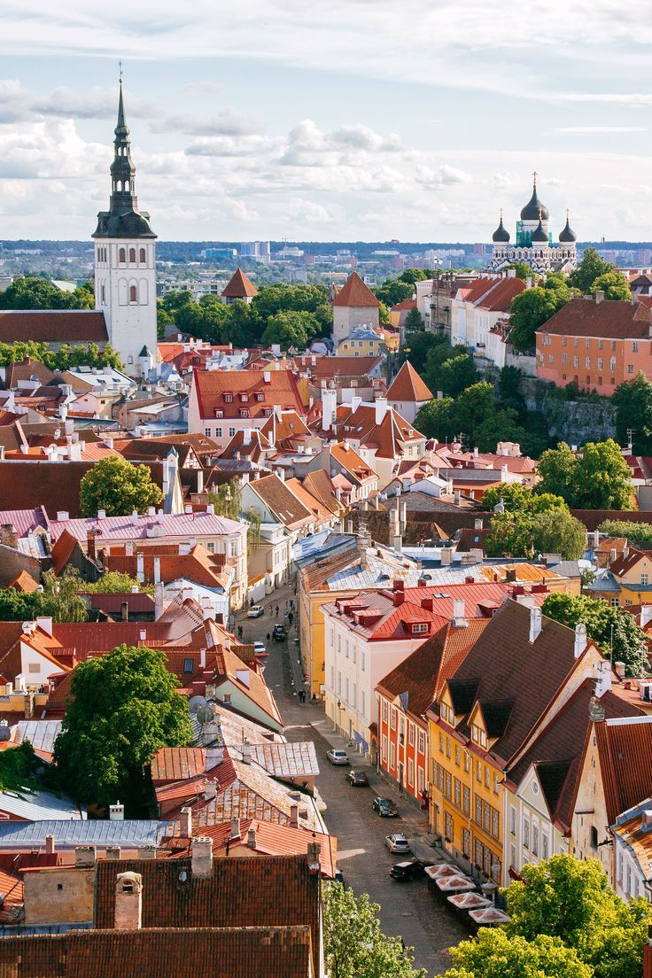 an aerial view of a city with tall buildings