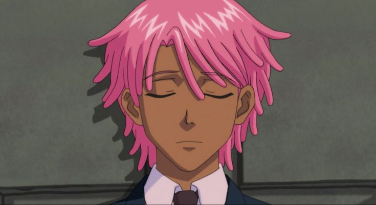 a man with pink hair wearing a suit and tie