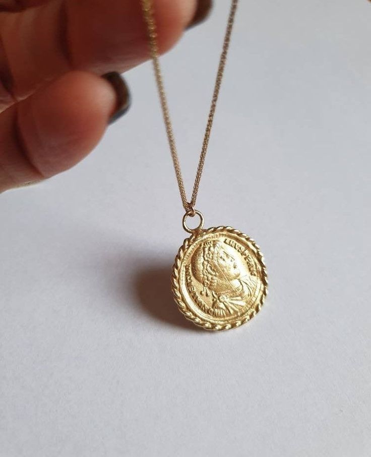 Solid gold coin necklace, 14k gold necklace, coin pendant necklace, medallion necklace, coin necklace, gold pendant necklace An old Greek coin, made of solid gold which was duplicated and wrapped with twisted gold wires to make a beautiful medallion pendant. The antique coin is not a perfect circle in shape and a little rustic. The necklace is available in gold filled, sterling silver, 9k and 14k solid gold. You can also purchase the pendant only if you wish. This 14k gold coin necklace is great Vintage Yellow Gold Coin Necklace, Tarnish Resistant, Yellow Gold Medallion Coin Necklace In Brass, Yellow Gold Necklace With Coin Pendant In Brass, Engraved Gold Plated Medallion Necklace, Yellow Gold Coin-shaped Brass Necklaces, Yellow Gold Coin Necklaces In Brass, Yellow Gold Coin Necklace With Locket In Brass, Yellow Gold Engraved Medallion Coin Necklace, Yellow Gold Brass Coin Necklace With Locket