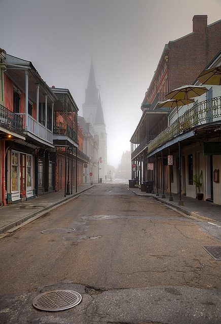 an empty street with buildings on both sides