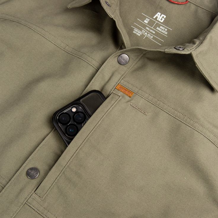 The Farmhand Overshirt is our take on the shirt jack. This work shirt layers over your tees or button-ups as a secondarily layer of warmth and protection. This cotton-performance outer shell keeps the elements out so you can be comfortable all day. Outer layer shell snap-up shirt Hidden Secure Cellphone zipper chest pocket Hidden snap down collar Anti-microbial Stain Resistance Extreme Durability Water Resistant Product Composition: 100% Cotton Style: A1500009 Product Composition, Trousers Details, Weather Change, Men Trousers, Coffee Latte, Work Shirt, Men Shirt, Pocket Shirt, Latte Art