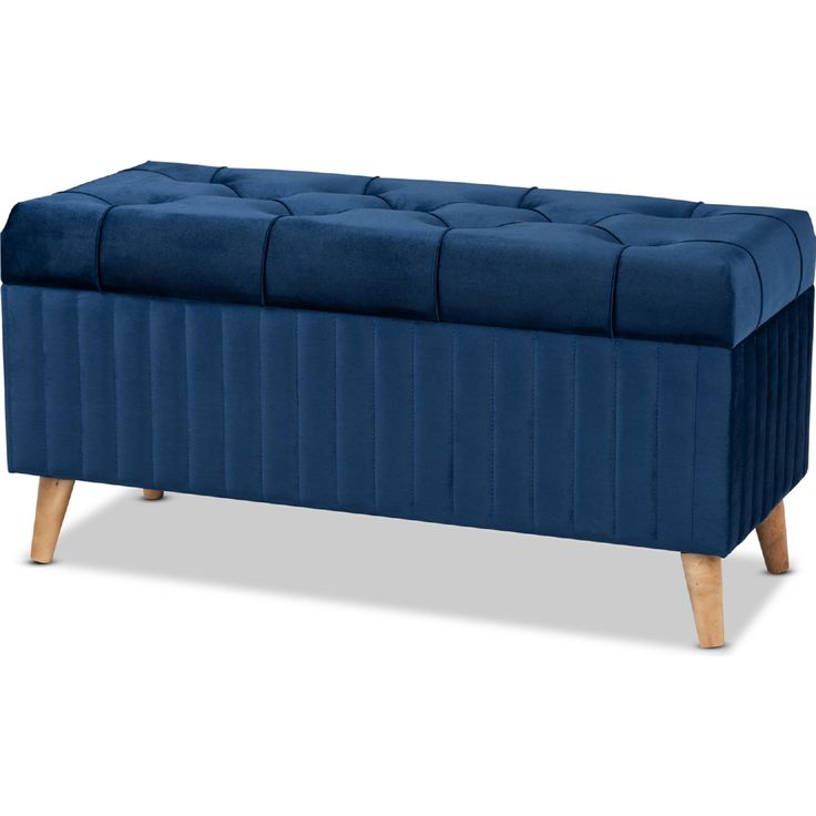 a blue bench with wooden legs and a buttoned up seat on the bottom side