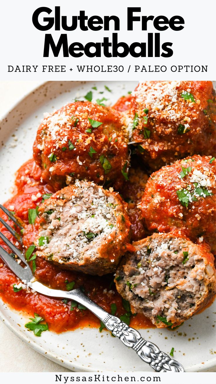 a white plate topped with meatballs covered in marinara sauce